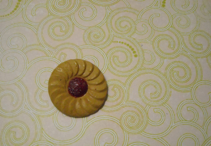 Strawberry Whirl brooch on whirl paper